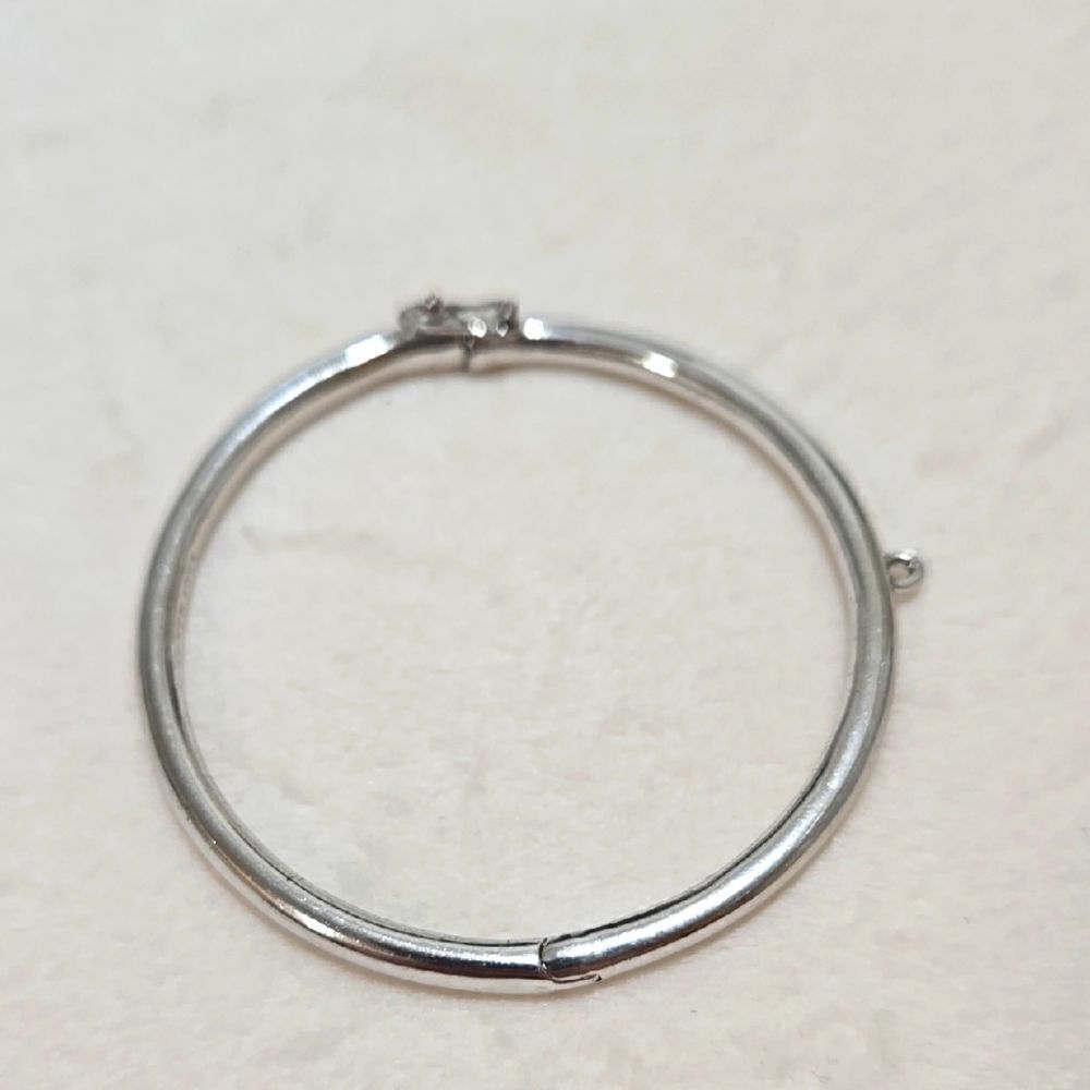 Kate Spade New York hinged silver bangle bracelet